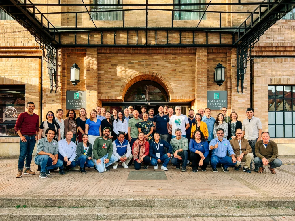 A group of ABC fellows stand outside of a hotel.